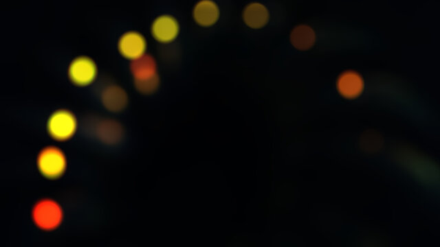 Abstract blur image background of darkness with lights bokeh of lights bulb, colourful bokeh.