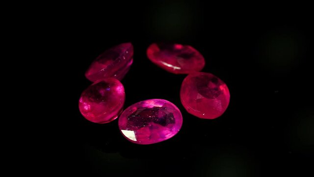 natural red rhodolite gemstone on the turning table