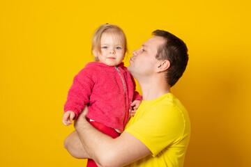 Family, fatherhood and people concept - happy father holding little baby daughter.