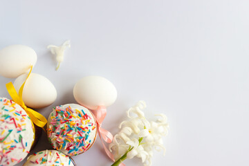 Traditional Easter cakes and Hyacinthus flowers on white background with copy space for text. Traditional Kulich, Paska Easter Bread. Postcard