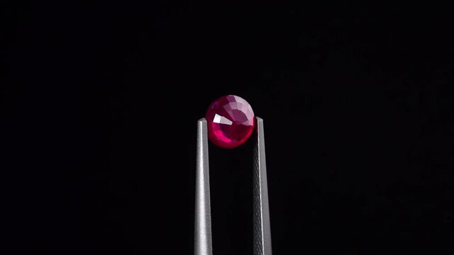 natural red rhodolite gemstone on the turning table