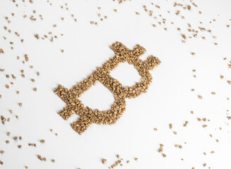Perspective view on bitcoin sign made from pieces of gold