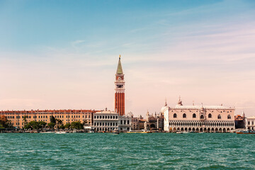 Fototapeta na wymiar Sea view from Piazza San Marco in Venice, with the bell tower of St. Mark in the background. Venetian lagoon with the Basilica of Santa Maria della Salute, the entrance to the Grand Canal