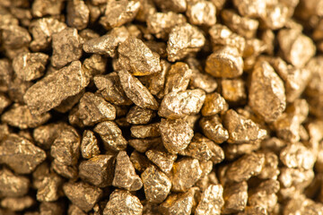 Macro view on handful of pieces of gold