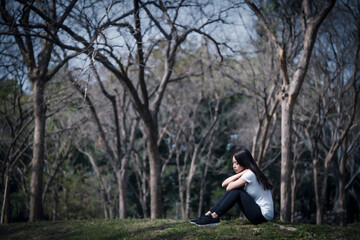 She sat sadly, lonely, without the strength to face other people.