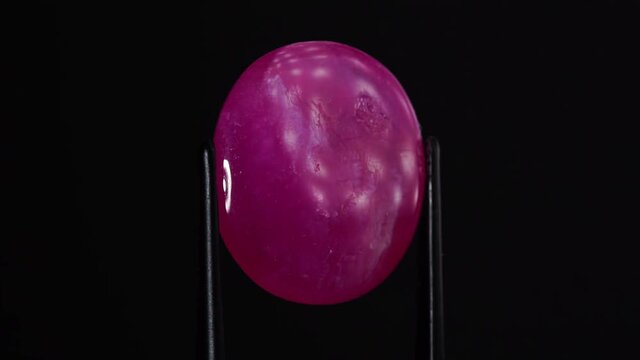 natural red rhodolite gemstone on the turning table