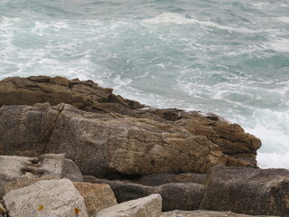 waves creating new forms on the rocks