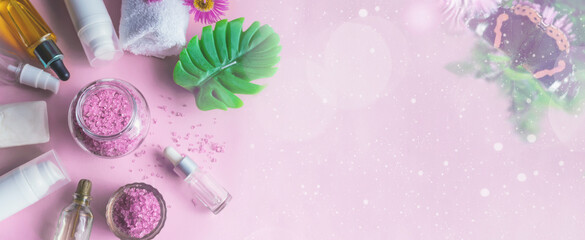 Lavender sea salt with natural spa products and on a pink background. copy space. Banner