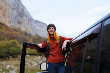 cheerful woman hiker nature mountains travel car