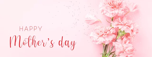 Banner with pink carnations on pink background with Happy Mother's day greeting. © Olga Zarytska