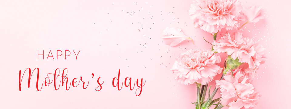 Banner with pink carnations on pink background with Happy Mother's day greeting.