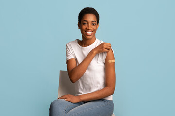 After Vaccination Concept. Vaccinated Black Woman Showing Arm After Coronavirus Vaccine Injection