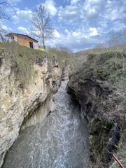 Close up of impressive canyon in spring season. Narrow deep river valley in mountainous terrain.