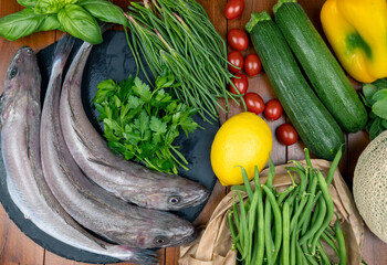 Ingredients of the mediterranean diet. Mediterranean food. Fresh raw fish with zucchini, cherry...