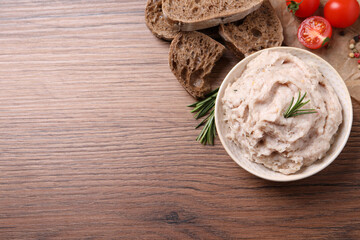 Delicious lard spread in bowl on wooden table, flat lay. Space for text