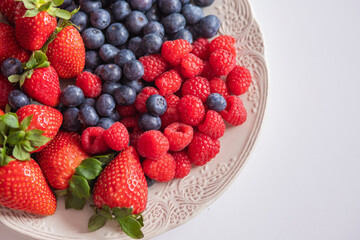 fresh ripe juicy wild berries raspberries and blueberries