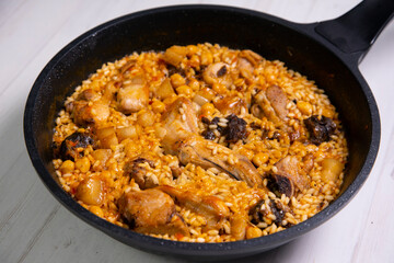 Montaña rice with wild rabbit, blood sausage, pork rib and chickpeas. Traditional spanish rice and tapa.
