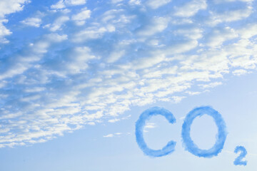 Naklejka premium CO2 emissions. View of blue sky with white clouds