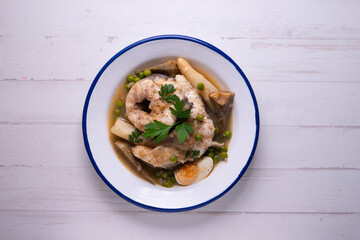 Conger eel with artichokes and white asparagus. Typical Spanish coast dish.