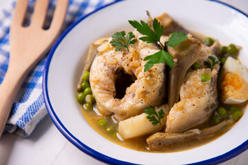 Conger eel with artichokes and white asparagus. Typical Spanish coast dish.