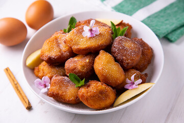 Fried buñuelos with ricotta cheese and apple.