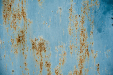 background metal surface with blue paint and rust