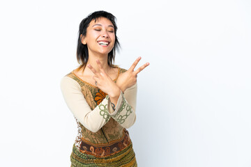 Young Uruguayan girl over isolated white background smiling and showing victory sign