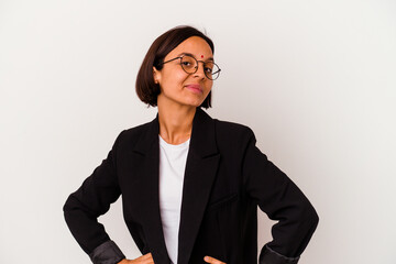 Young business Indian woman isolated on white background confident keeping hands on hips.