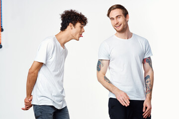 emotional men in white t-shirts antics fun isolated background