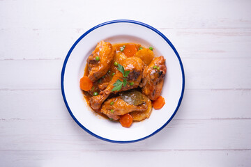Chicken with potatoes and vegetables. Traditional tapa spanish recipe.