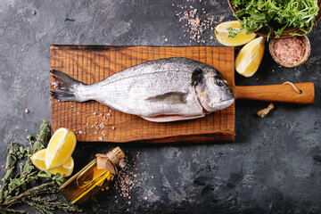 Raw uncooked fresh gutted sea bream or dorado fish