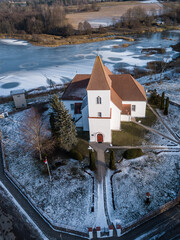 Aerial view of Alsunga catholic chursh in winter, Latvia. 