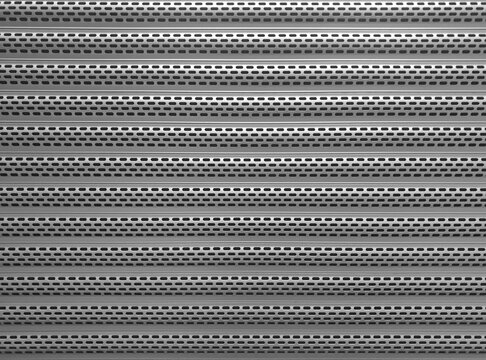 Texture of closed iron roller shutters on a shop window closeup