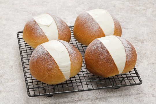 homemade Maritozzo is italian roman breakfast sweet that whipped cream sandwiched between brioche.