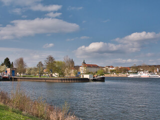 River Weser in Hameln, Germany under a beautiful blue sky with fluffy clouds