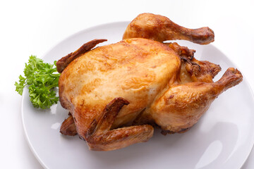 Baked chicken on a white plate. Isolate