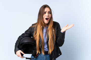 Woman with a motorcycle helmet with surprise facial expression