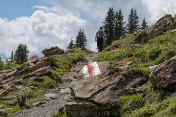 Hiking trail in switzerland, alpine hiking in the swiss alps.