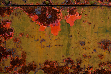 background metal surface with green-red peeling paint