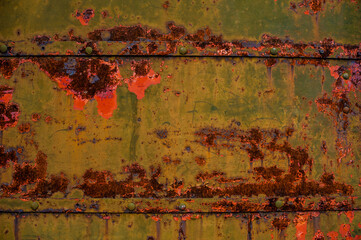 background metal surface with green-red peeling paint