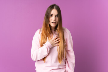 Fototapeta premium Young caucasian woman isolated on purple background pointing to oneself