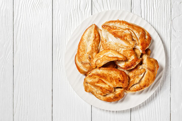 Roast Chicken breasts on a plate, top view