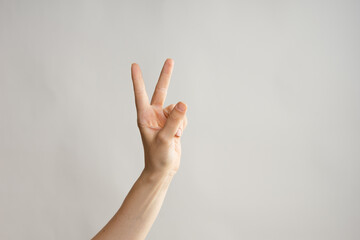 Hand gestures, Two thumbs up, a victory gesture. Women's hand