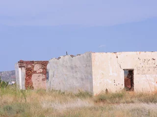 Fotobehang Ruins and remaining walls of a structure of the ghost town in Montoya, New Mexico. © raksyBH
