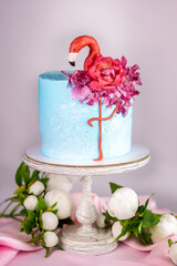 Pink and Blue Flamingo Birthday Cake with Peony Flowers Bouquet
