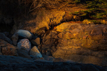Sunlight Creates Spotlight on Rocky Cliff