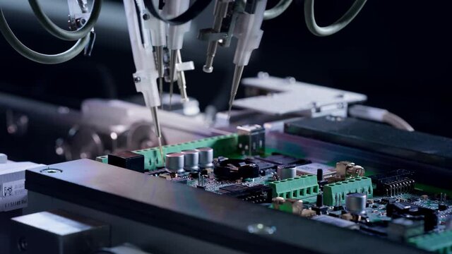 Electronic circuit boards production and installation of SMD components. Needle automatic equipment diagnose and test chips and processors. Manufacture of electronic chips. High-tech, close-up