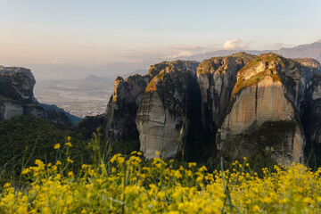 Meteora rock formation in Kalambaka, Greece: a geological phenomen with blooming rapeseed