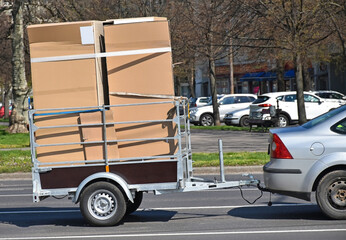 Car with a trailer transports a large cargo
