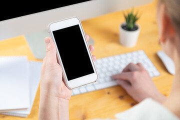 hands of women who use laptop keyboard and mobile phone. concept of email delivery and use of online technology